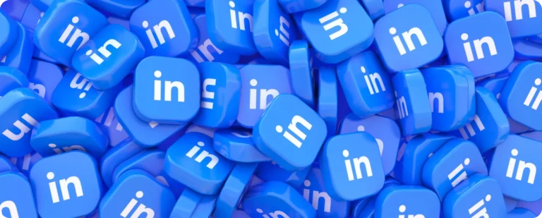 A graphic image featuring a large pile of blue LinkedIn logo buttons