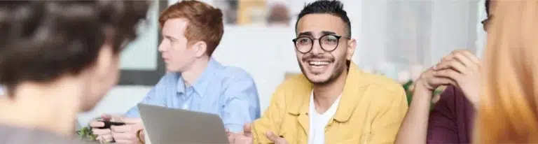 Team collaborating with laptops.