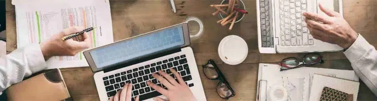 Business team busy with laptops