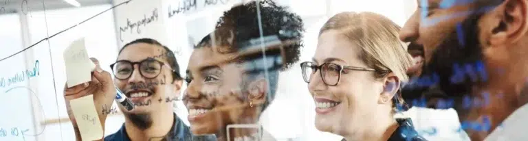 Team discussing the best time to send cold emails.