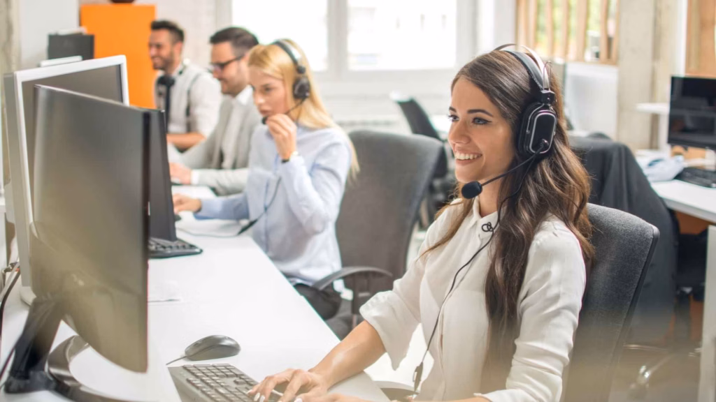 Employees at desks engaging in successful outbound calls