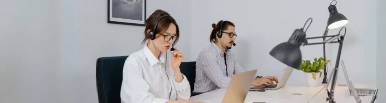 Team using B2B cold calling tips at desks.