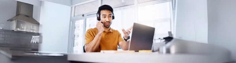 A fractional sales consultant speaking by phone with a client