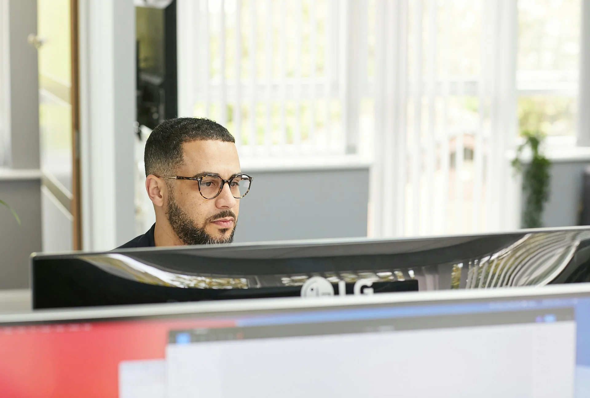 A man using lead generation technologies at a desk