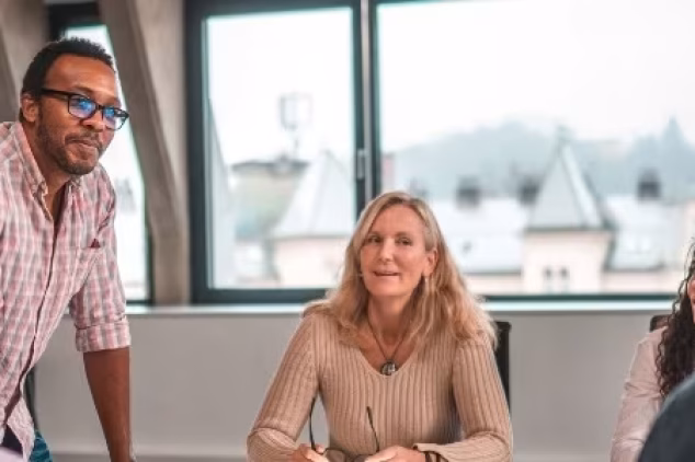 Group meeting discussing strategies used by lead generation email marketing companies.