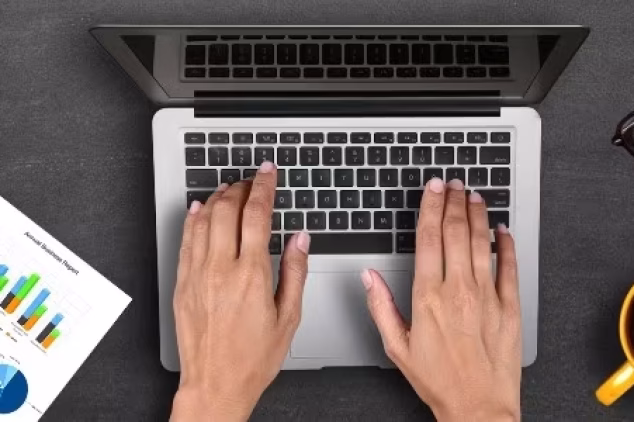 Person on laptop providing targeted email marketing campaign.