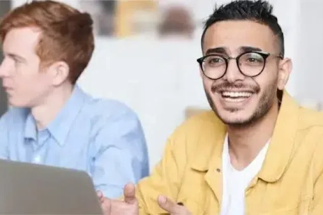 Team collaborating with laptops.