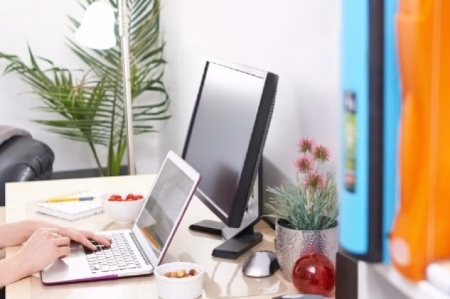 Woman working on a desktop for blog writing services.