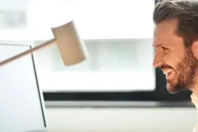 A business owner happy with the leads generated by his outsourced SDRs