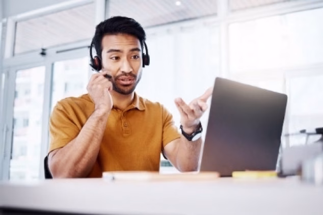 A fractional sales consultant speaking by phone with a client