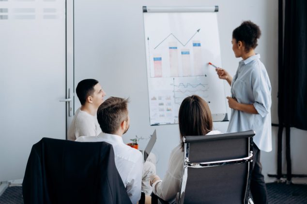 A sales development consultant reviews lead gen KPIs with clients